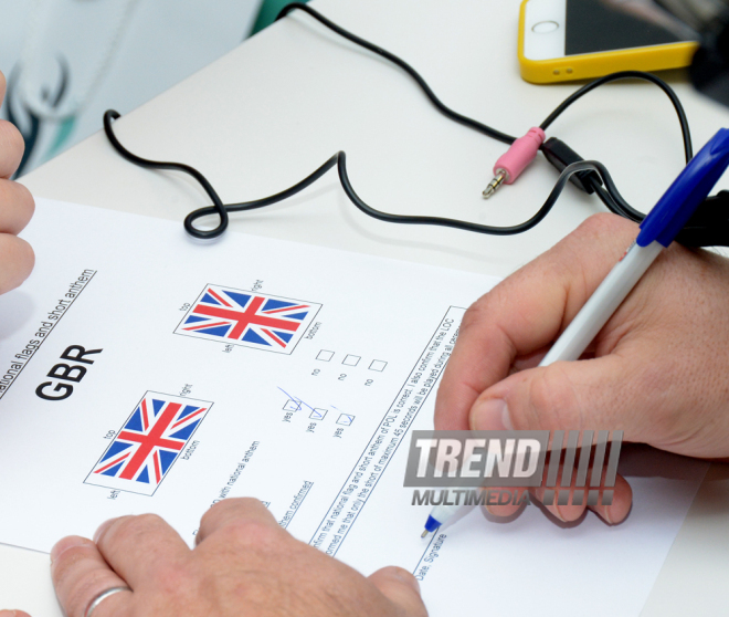 Делегации различных стран проходят аккредитацию на Кубок мира по прыжкам на батуте в Баку. Азербайджан, 3 март, 2016 